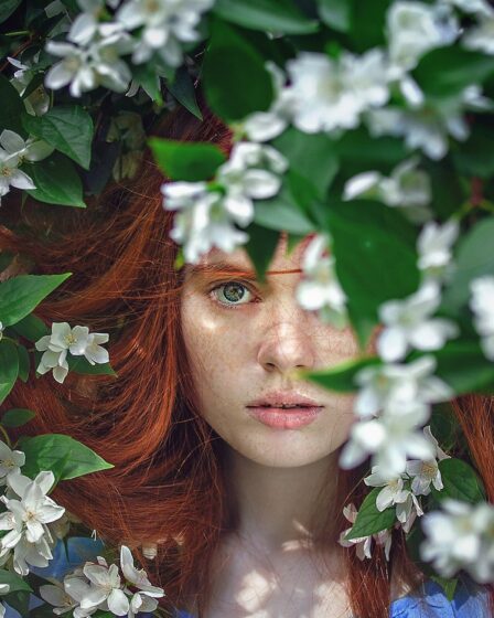 sustainable beauty woman with red hair in nature