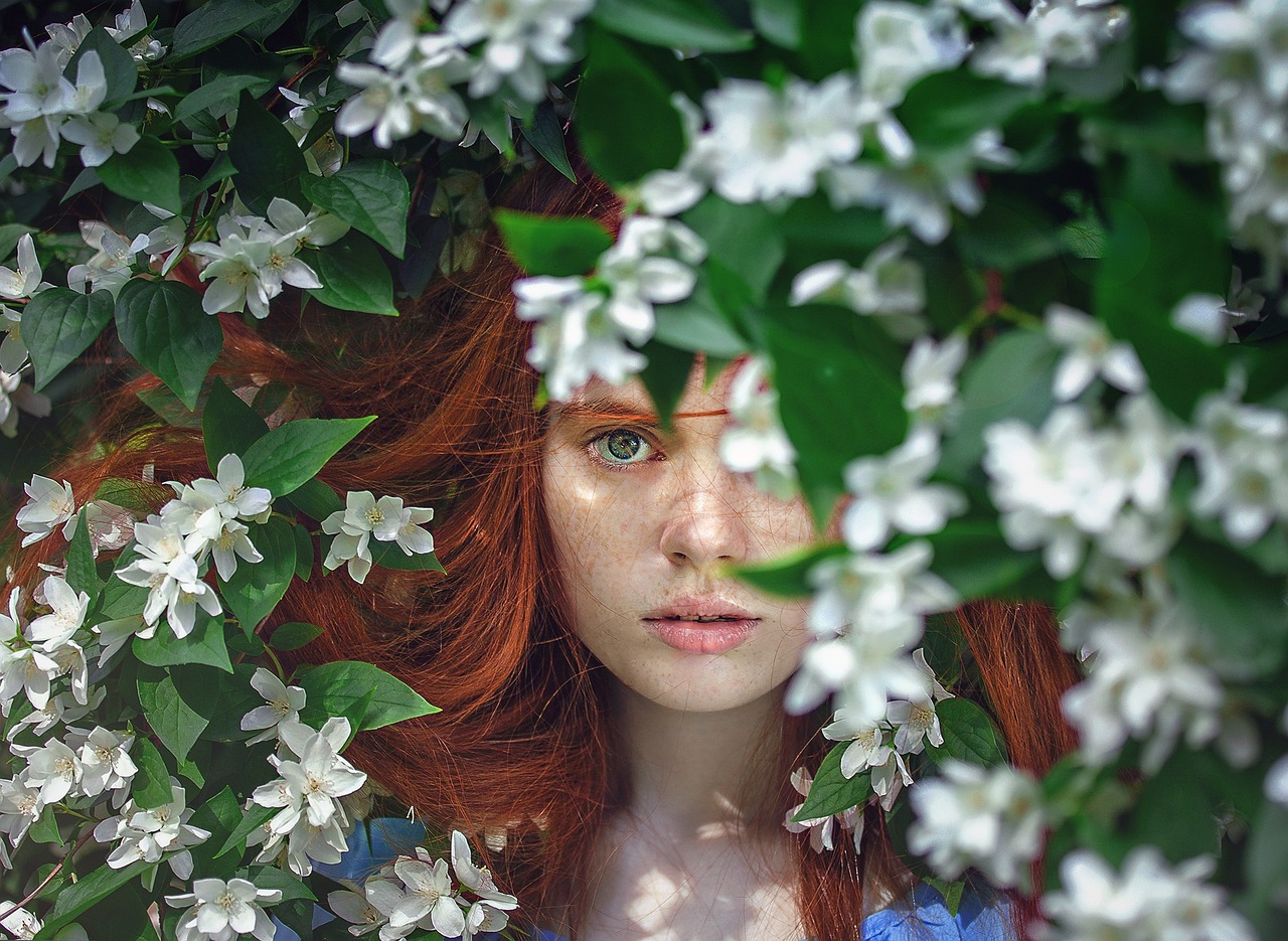 sustainable beauty woman with red hair in nature